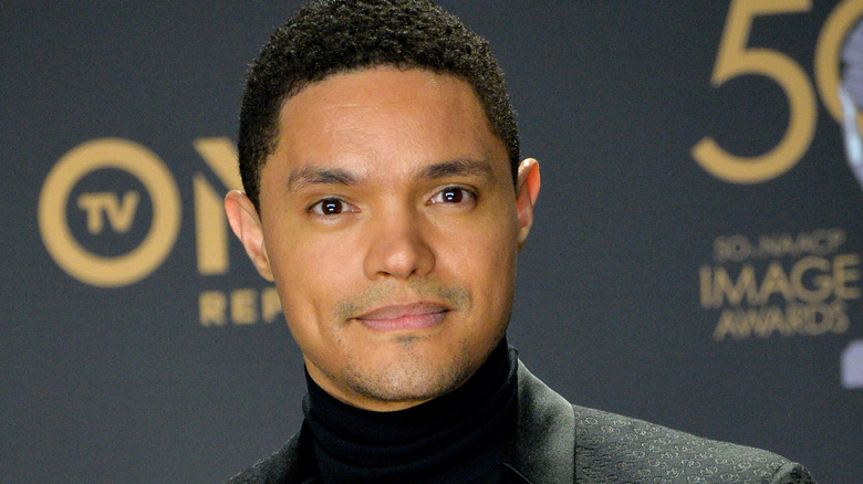 Trevor Noah serious smile