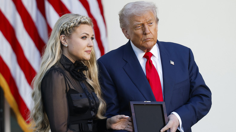 Erika Kirk accepting the Presidential Medal of Freedom from Donald Trump