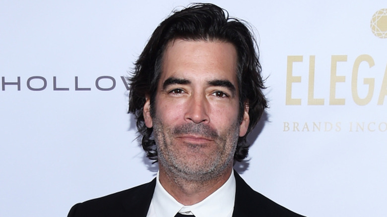 Carter Oosterhouse posing at the 2019 WildAid Gala at the Beverly Wilshire Four Seasons Hotel