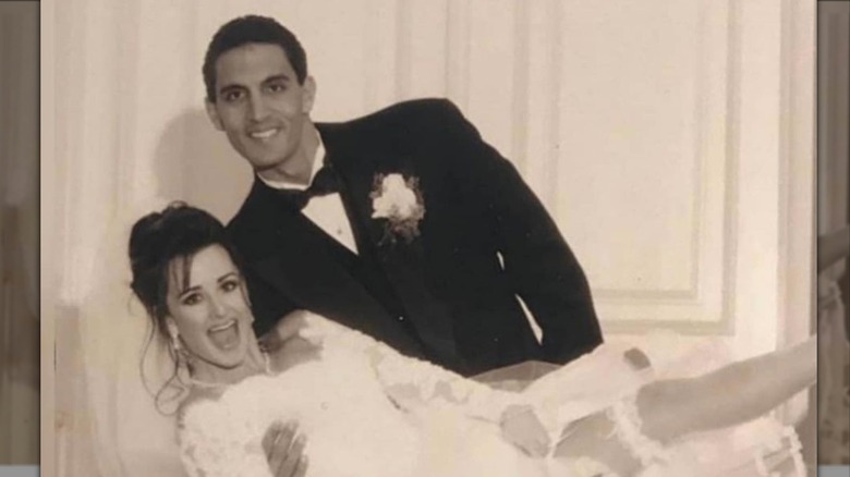 Kyle Richards and Mauricio Umanksy posing together in wedding photo