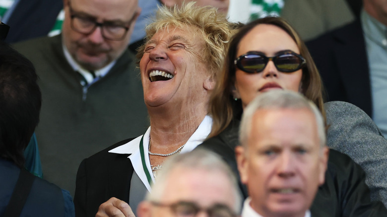 Rod Stewart laughing at a Premier League match.