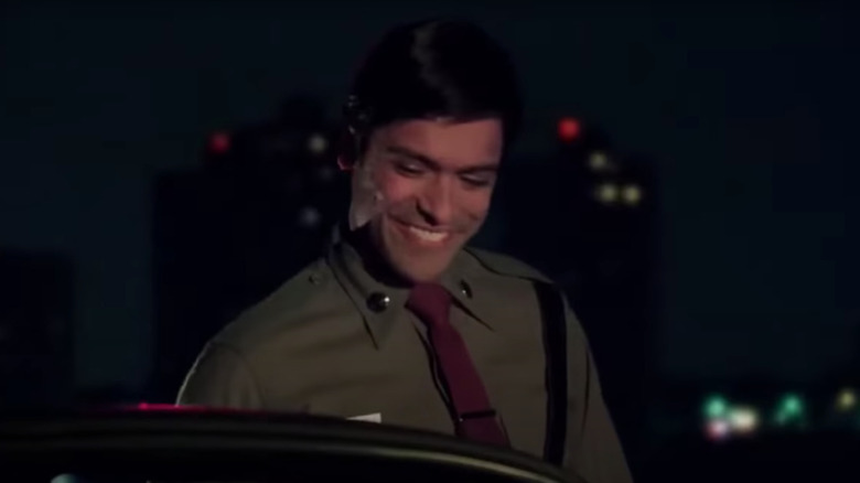 Mark Consuelos smiling as cop on Friends