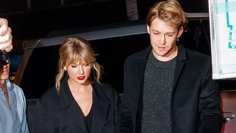 Joe Alwyn and Taylor Swift walking