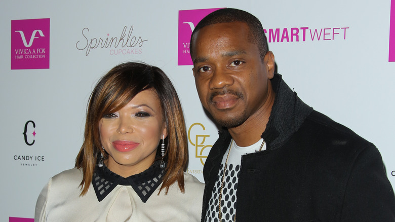 Tisha Campbell and Duane Martin posing