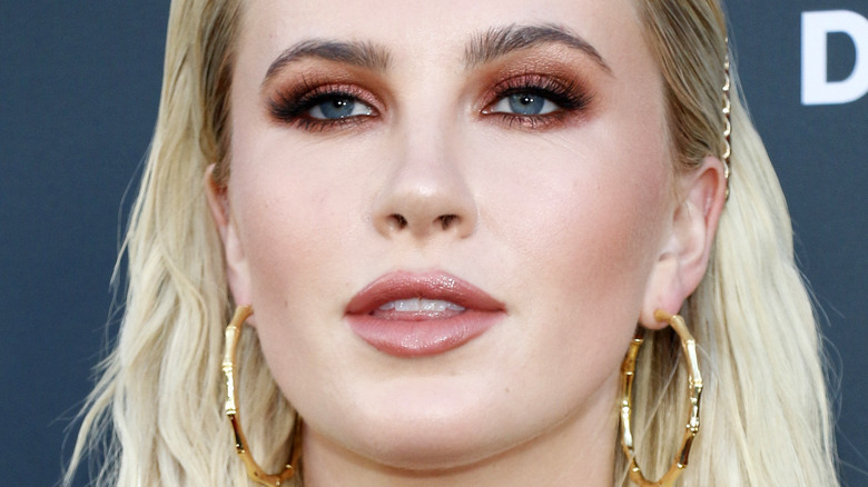 Ireland Baldwin poses in gold hoop earrings