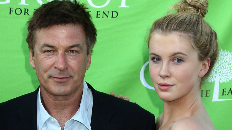 Alec and Ireland Baldwin pose side by side in 2012