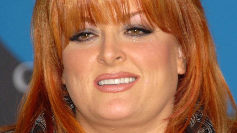 Wynonna Judd smiling at premiere