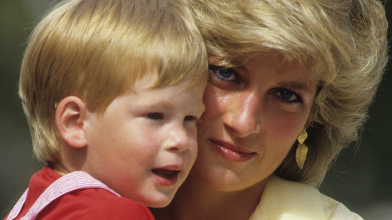 Princess Diana holding baby Prince Harry
