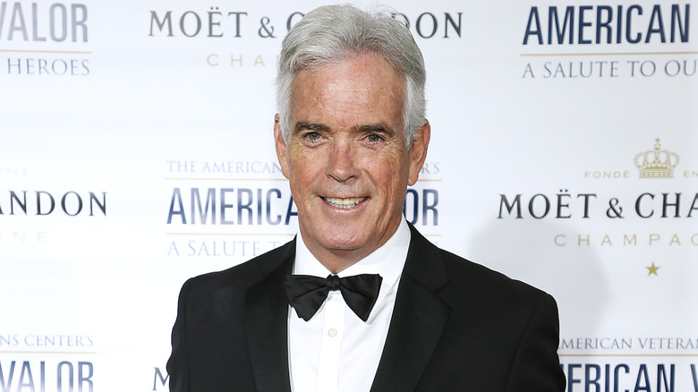 John Roberts posing on the red carpet.