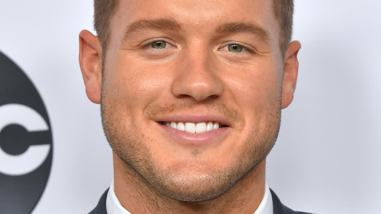 Colton Underwood smiling on red carpet