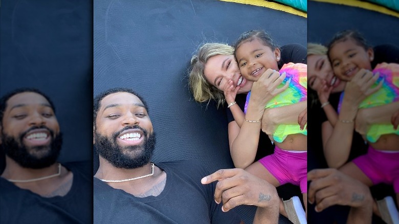 Tristan Thompson, Khloé Kardashian, and their daughter True smiling in an Instagram selfie