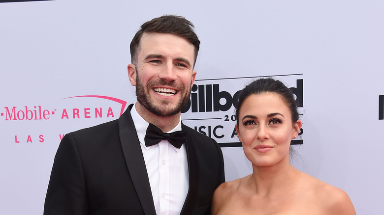 Sam Hunt smiles with wife