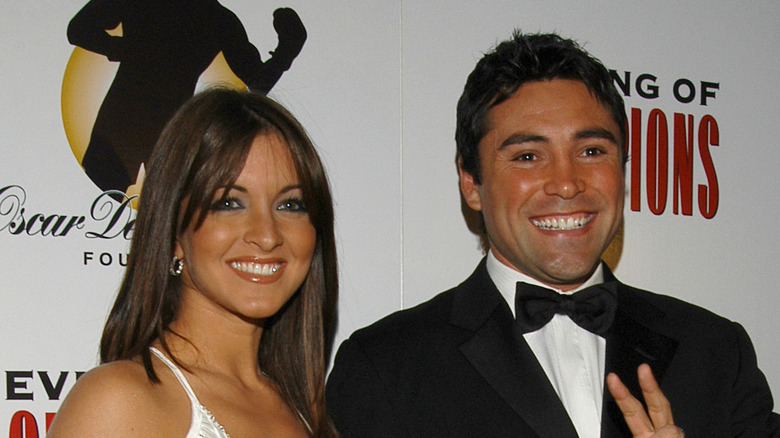 Millie Corretjer and Oscar De La Hoya smiling