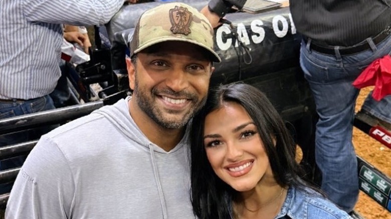 Kash Patel and Alexis Wilkins pose together during rodeo