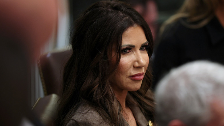 Kristi Noem, looking grim, at a meeting in January