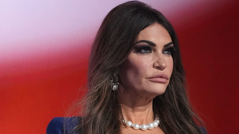 Kimberly Guilfoyle looks serious during speech