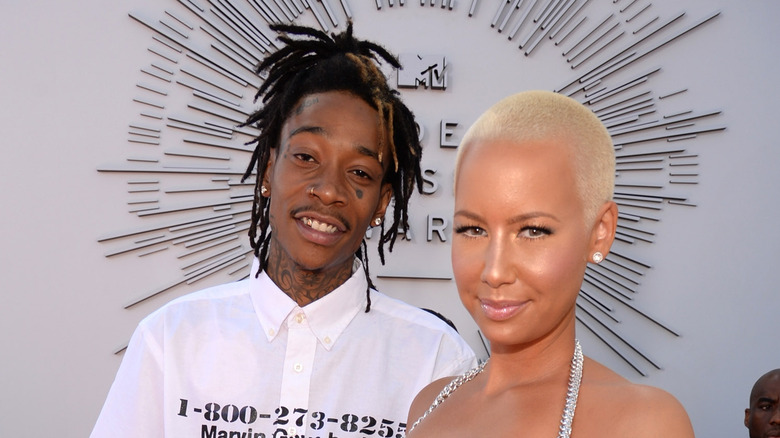 Wiz Khalifa and Amber Rose stand side by side
