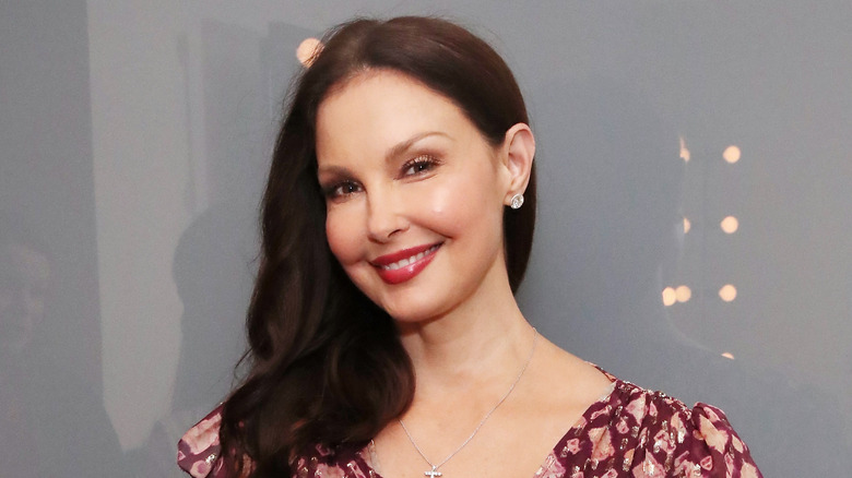 Ashley Judd poses in blue drop earrings