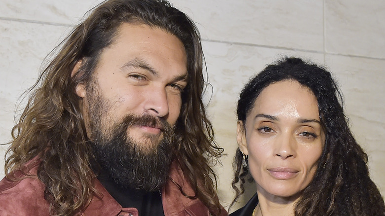 Jason Momoa and Lisa Bonet posing