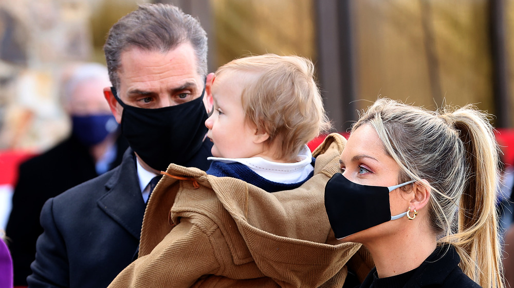 Hunter Biden holding his son Beau during the inauguration 