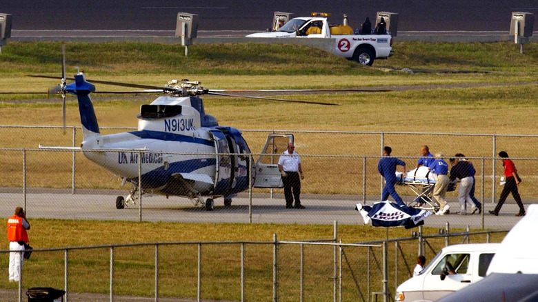 Jason Priestley being taken to helicopter