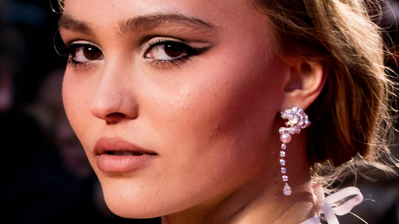 Lily-Rose Depp poses in drop earrings