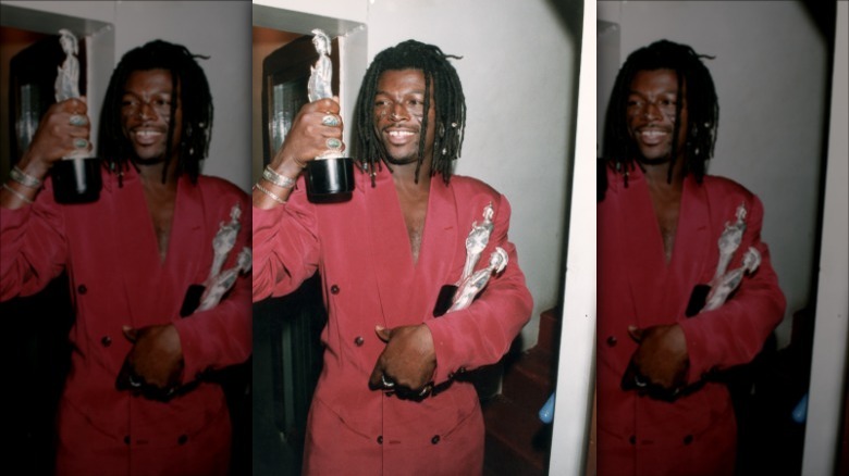 Seal holds an award in the 1990s