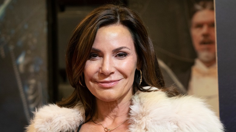 LuAnn de Lesseps smiling in a fur shawl