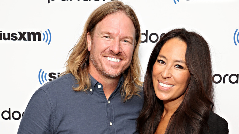 Chip and Joanna Gaines pose in 2021