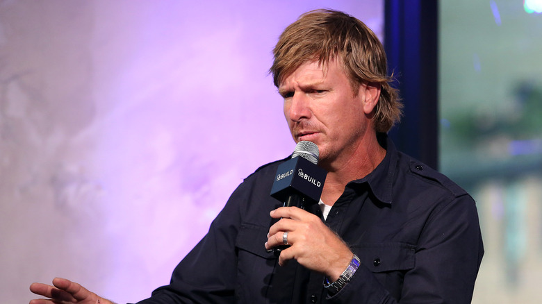 Chip Gaines speaks into a microphone