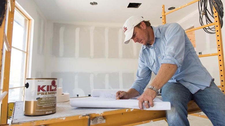 Chip Gaines works on a renovation project