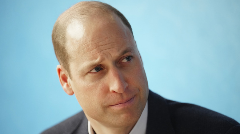 Prince William frowning