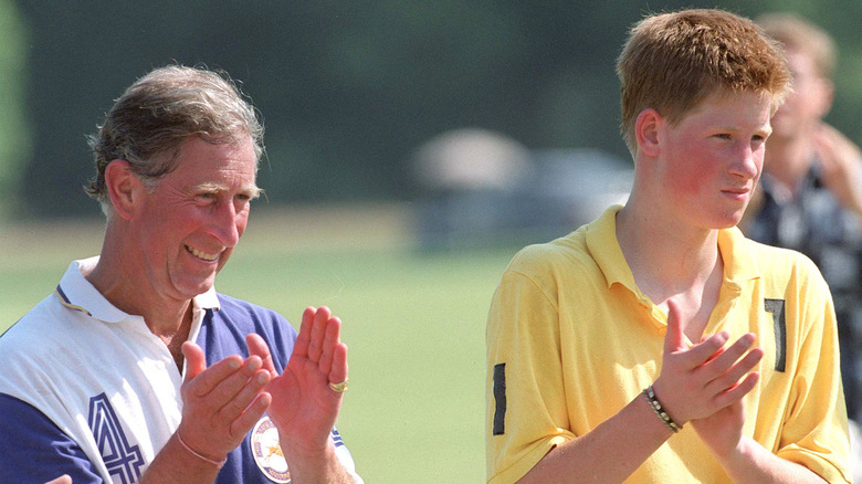 Prince Charles and Prince Harry clapping