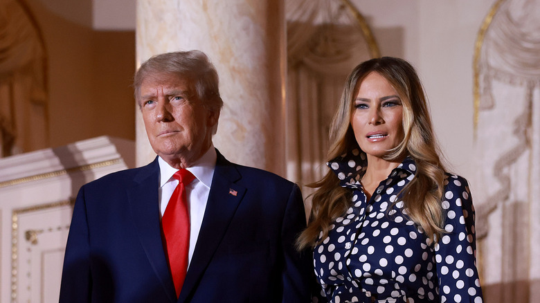 Donald and Melania Trump standing