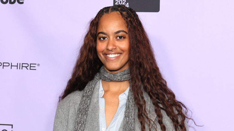 Malia Obama smiling with her hair down