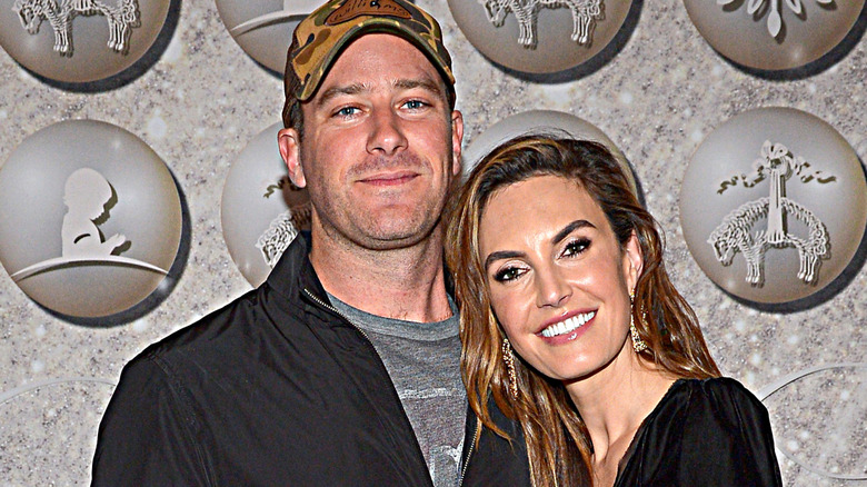 Armie Hammer and Elizabeth Chambers smiling in 2019