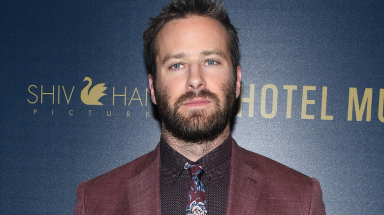 A bearded Armie Hammer looking serious at a Hotel Mumbai screening
