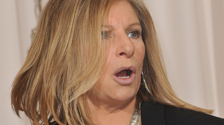 Barbra Streisand on red carpet, mouth open