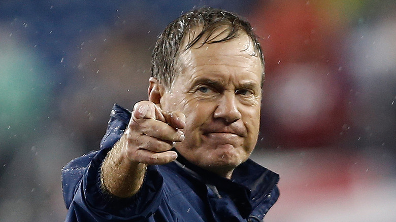 Bill Belichick pointing in the rain