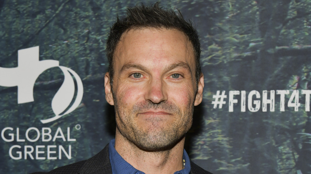 Brian Austin Green at a charity event, posing with a neutral expression