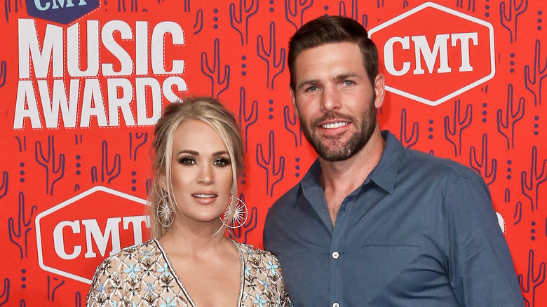 Carrie Underwood and Mike Fisher on the red carpet