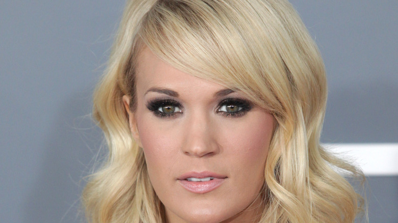 Carrie Underwood with a neutral expression