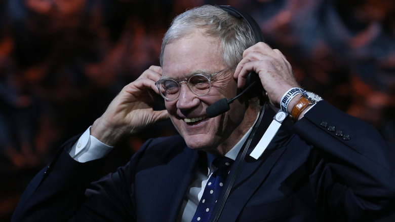 David Letterman's hands on ears