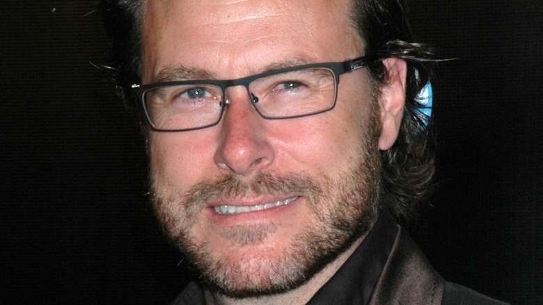 Dean McDermott slight grin, glasses on