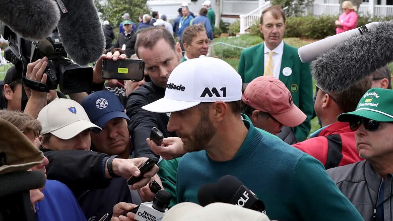 Dustin Johnson speaking with reporters