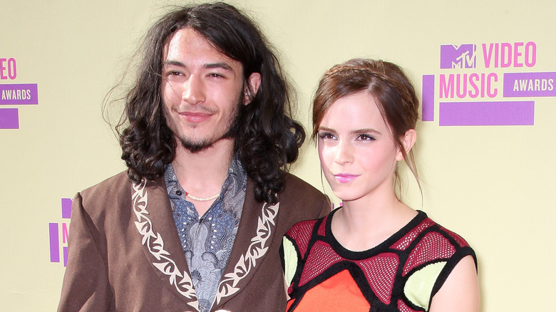 Ezra Miller and Emma Watson posing