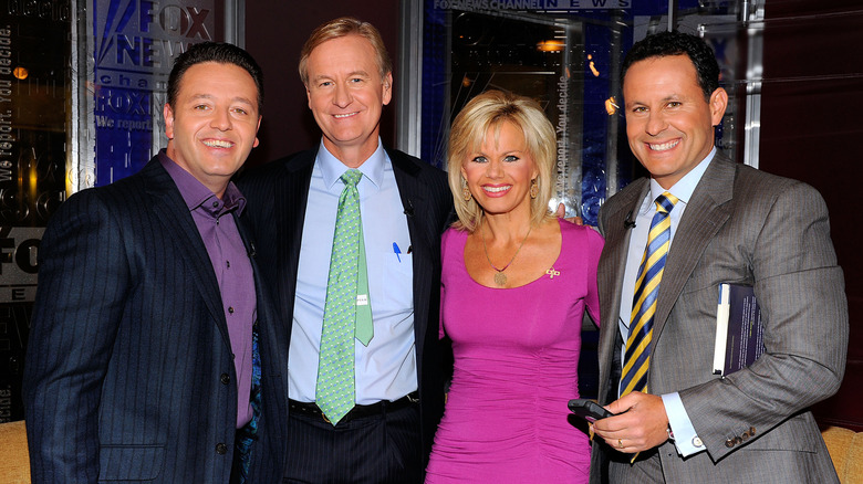 John Edward, Steve Doocy, Gretchen Carlson and Brian Kilmeade posing for a group photo at the FOX Studios