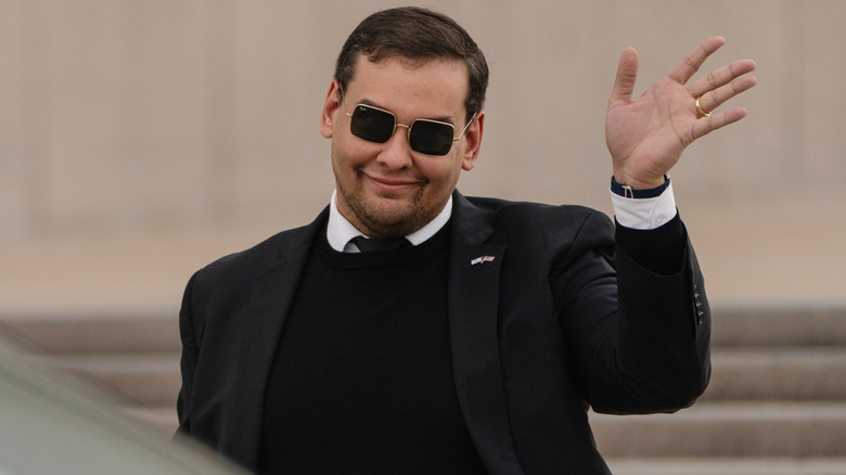 George Santos waving