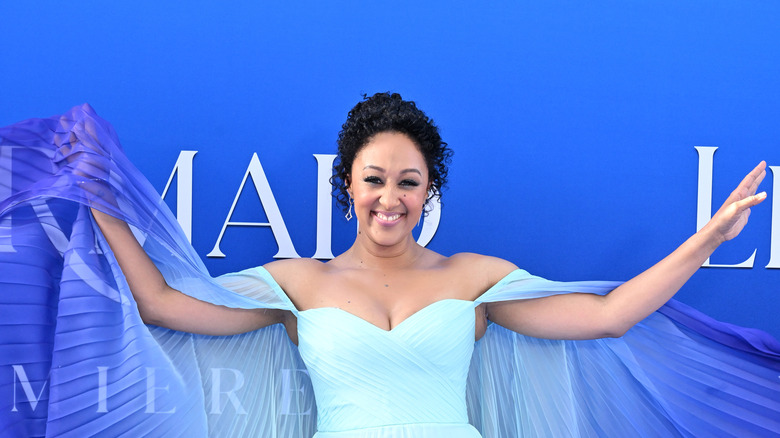 Tamera Mowry Housley in blue dress