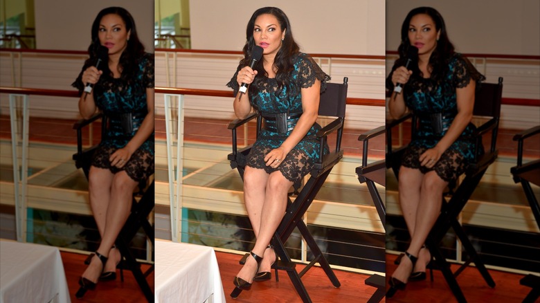 Egypt Sherrod sitting in a chair with a microphone at "THE PERFECT GUY" Press Dinner at Time Restaurant